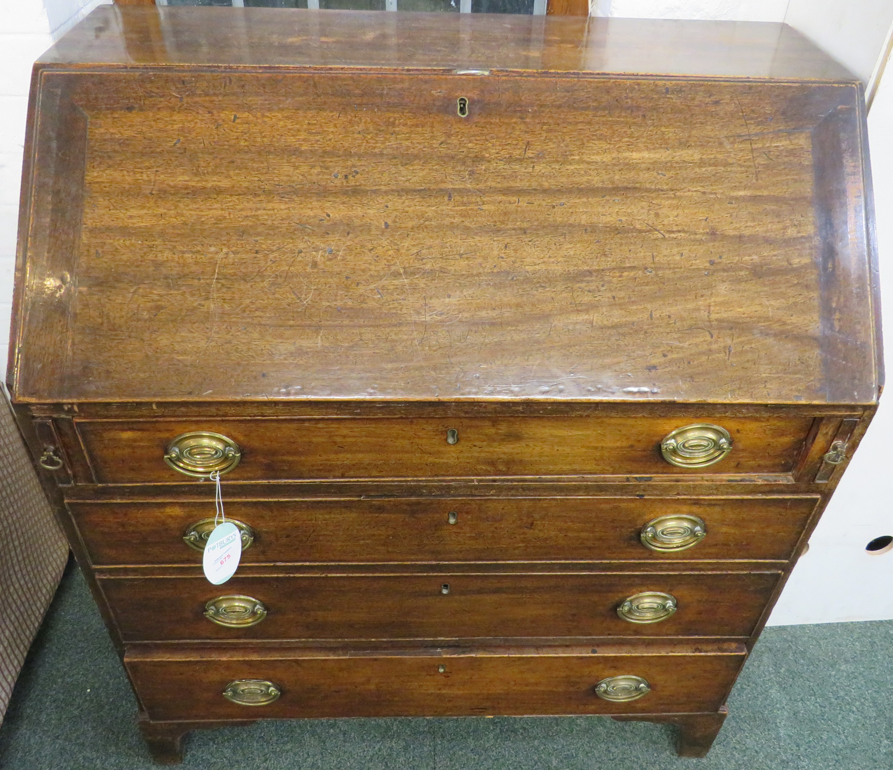 Mahogany bureau, the interior of the fall-front with pigeon holes, drawers and a central compartment