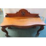Victorian mahogany serpentine front low hall table, standing on front cabriole legs with scroll feet