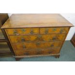 George III walnut chest of two short over three long drawers, the banded quarter-veneered top with