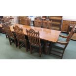 Oak reproduction refectory dining table and a set of eight Brights of Nettlebed oak chairs (