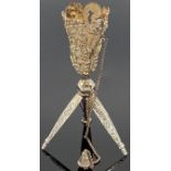 White metal posy holder, the pierced bowl with vines, flowers and scrolled foliage, sprung tripod