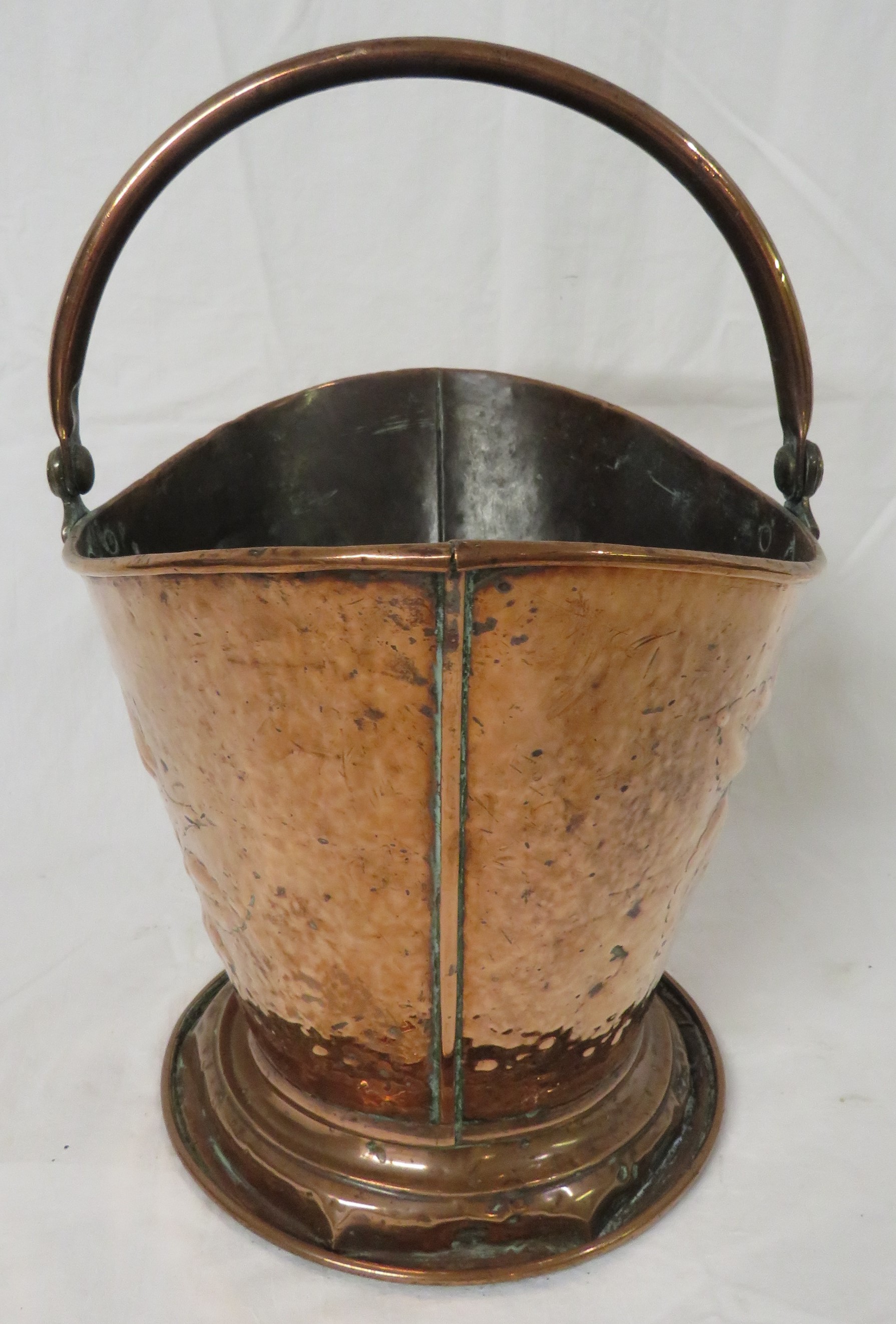 Art Nouveau copper coal bucket of cowl shape on a circular foot with hinged handle, the sides with - Image 2 of 4
