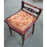 Small Edwardian stained mahogany stool with upholstered seat, baluster turned back rail and