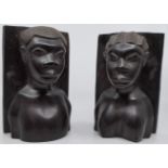 A pair of carved hardwood figural bookends as busts of tribal woman, height 22cm, width 14cm,