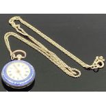 An early 20th century imported silver lady's fob watch with blue enamel and gilt case, crown