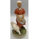 Royal Copenhagen porcelain figure of girl and goose, the girl in red dress with spotted scarf and