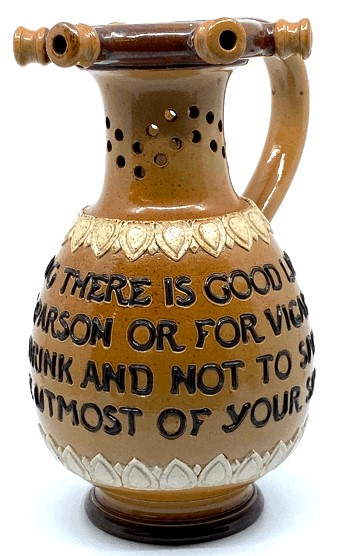 Doulton Lambeth puzzle jug with motto 'Within this jug there is good liquor...', (height 17.5cm),