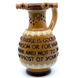 Doulton Lambeth puzzle jug with motto 'Within this jug there is good liquor...', (height 17.5cm),