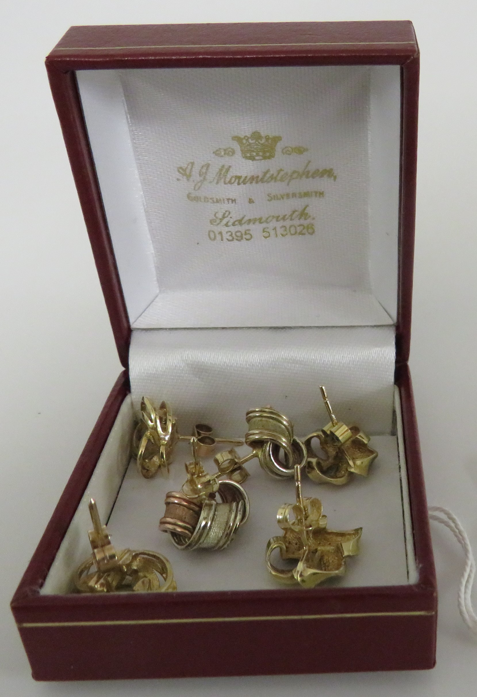 Three pairs of gold earrings - a pair of two-tone 9 carat gold knot earrings (combined 3.5g), a pair - Image 2 of 2