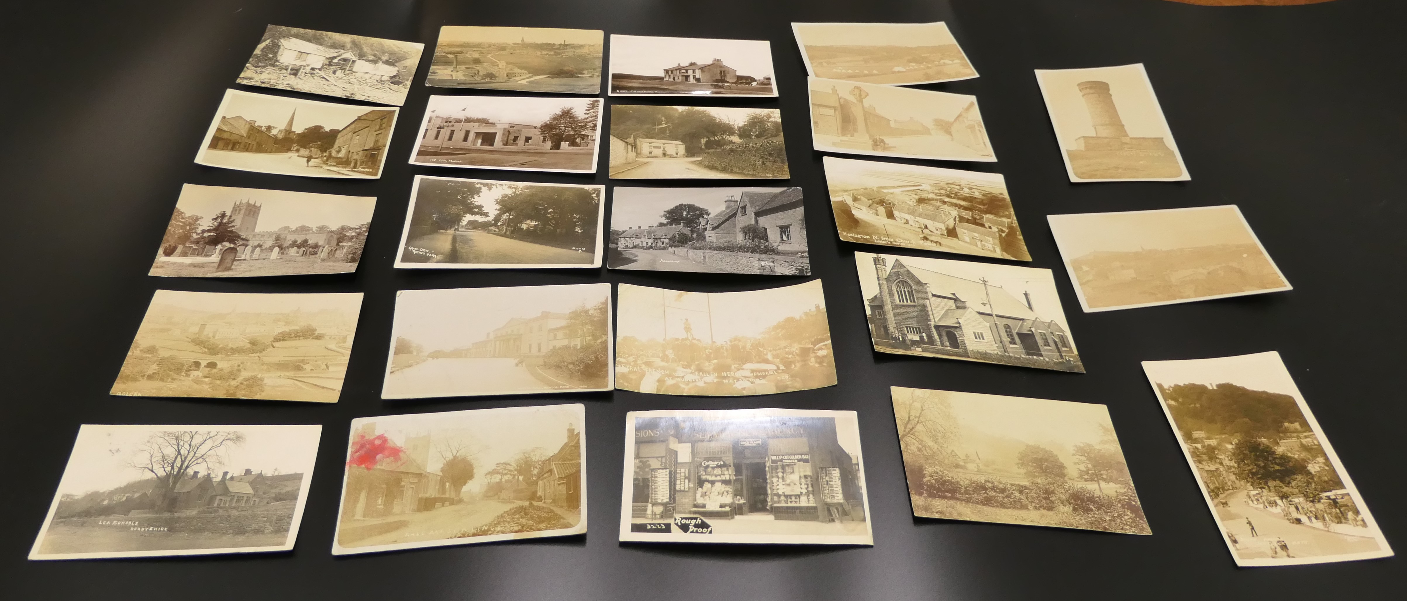 Twenty-three early 20th century real photographic postcards England topographical - including