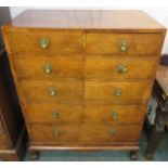 Banded mahogany chest of two short over four long graduated drawers, the top with oval walnut inlay,