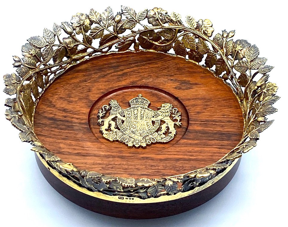 A silver-gilt mounted wine coaster, limited edition by Aurum Designs to commemorate the 80th