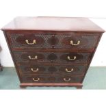 A 19th century tall mahogany chest of four drawers, the drawer fronts with lozenge blind fret