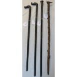 Four walking sticks - an ebonised walking cane with engine turned silver cap, marks for London,
