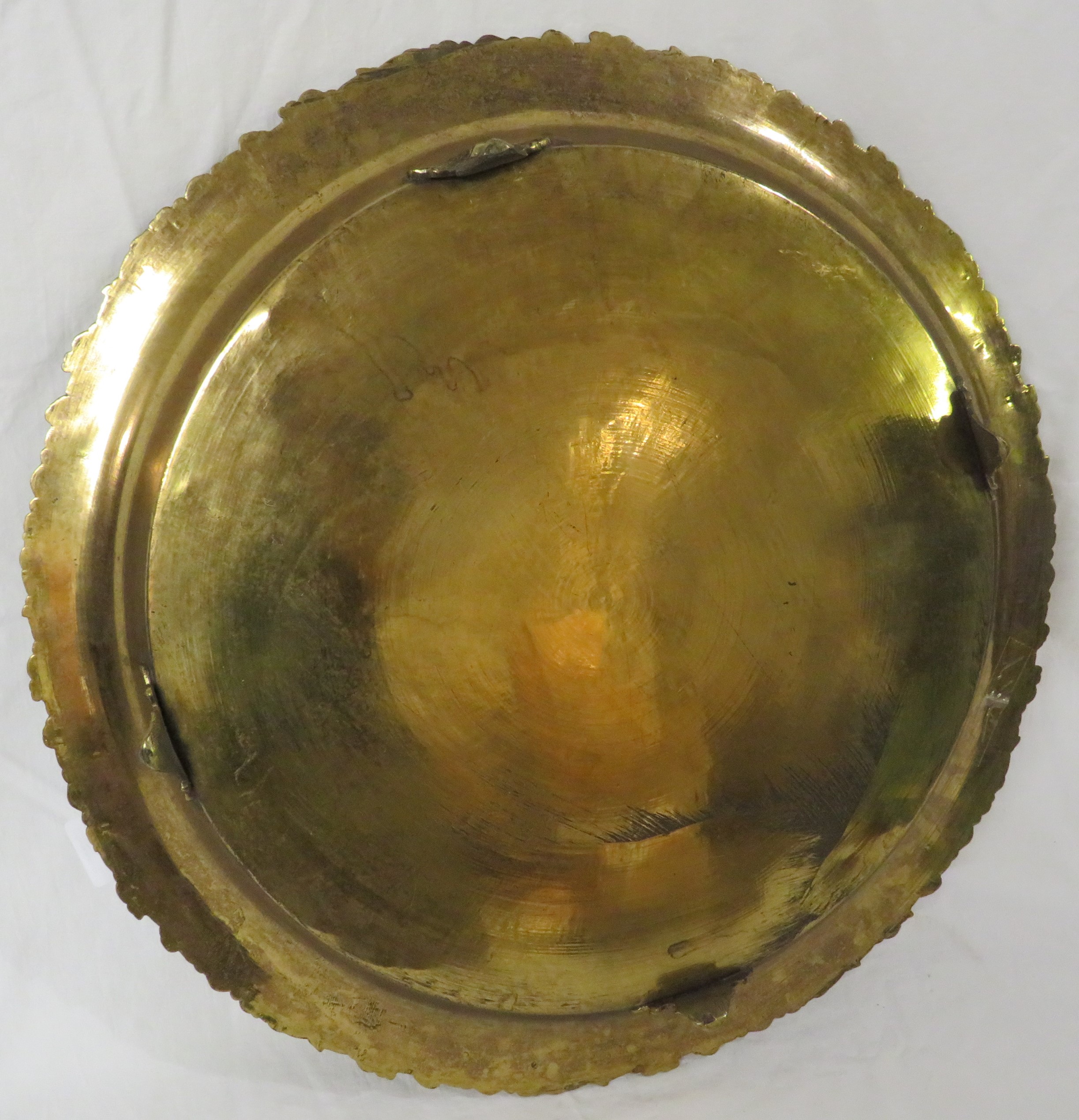 Large circular brass tray standing on four feet, the edge moulded with leaves and flowers, the - Image 3 of 3