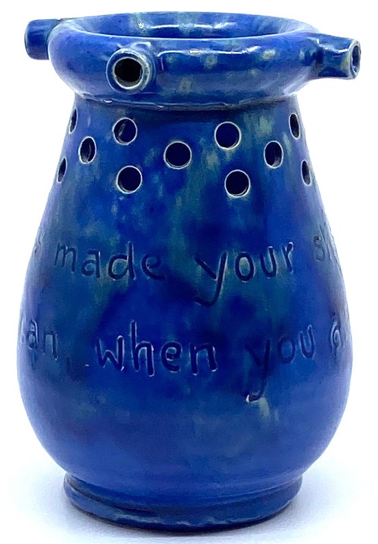 Baron Barnstaple Pottery puzzle jug in mottled blue glaze with motto "This jug was made your skill