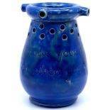 Baron Barnstaple Pottery puzzle jug in mottled blue glaze with motto "This jug was made your skill