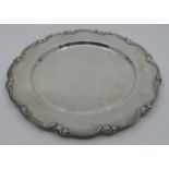 Circular white metal tray with moulded scrolled foliate border, diameter 28cm, 11.4 ozt, acid test