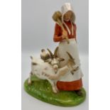 Royal Copenhagen porcelain group of woman with mallet and two billy goats, the woman in red dress,