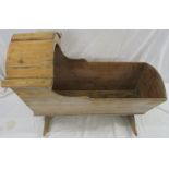 A stripped pine rocking crib, height 66.5cm, length 92cm, depth 53cm