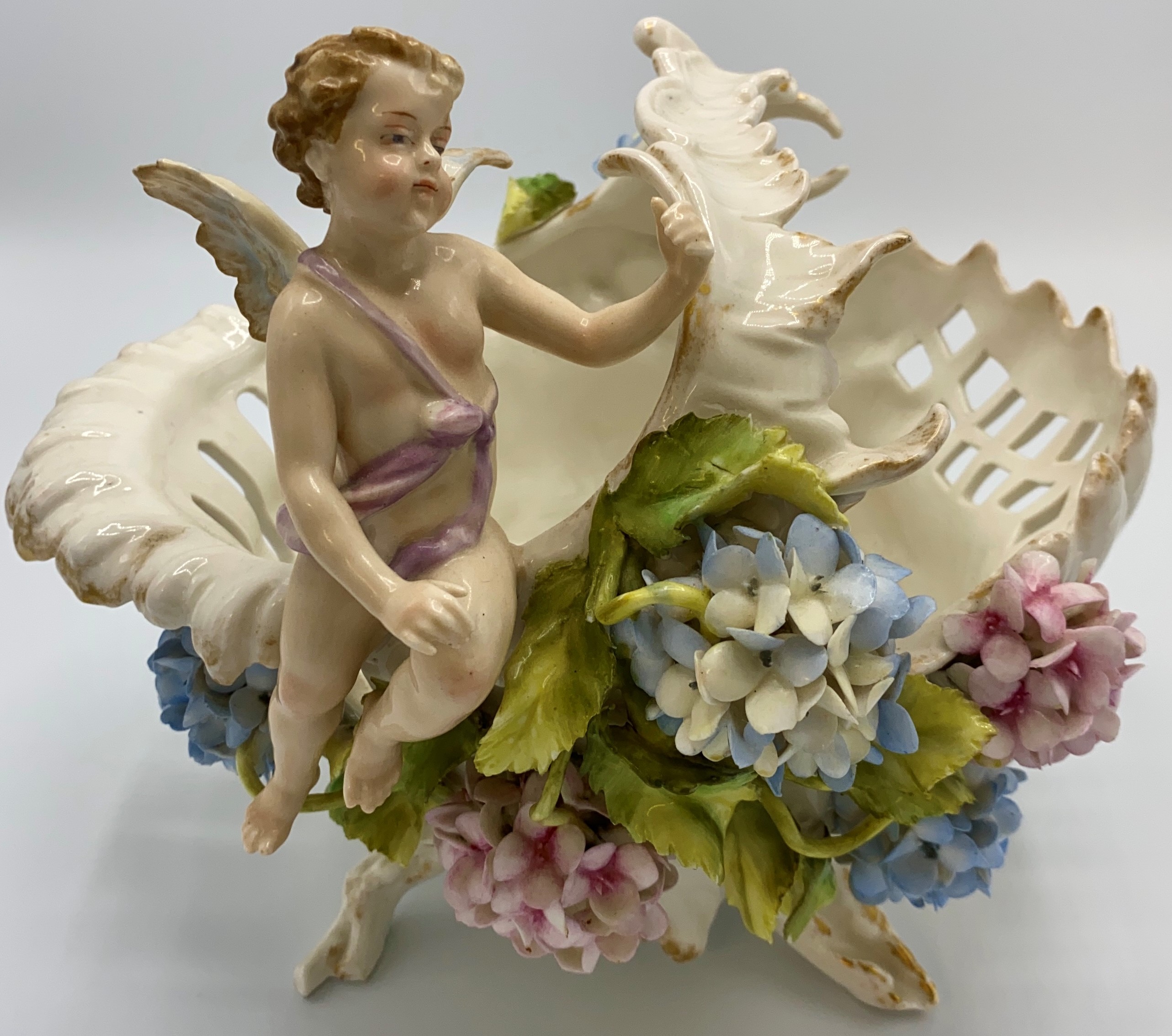 Continental white porcelain fruit basket of naturalistic form with gilding, encrusted with pink