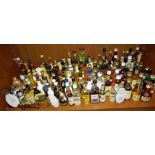 Approximately 150 bottles of liqueur, spirits and cider miniatures, some in ceramic and novelty