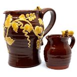 Cleverly Pottery milk jug in a treacle glaze with applied vine leaves and mouse (height 14cm), and a