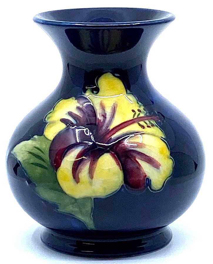 Moorcroft Pottery small baluster vase with flared neck, blue ground with tubelined decoration of red