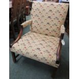 Georgian mahogany framed armchair with half-swept arms upholstered to the elbows, swept back legs