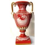 A 20th century pate sur pate continental porcelain vase of urn shape on a square base, decorated