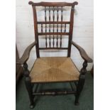 19th century oak armchair, ladder back with spindle turned supports and scrolled back rail, rush