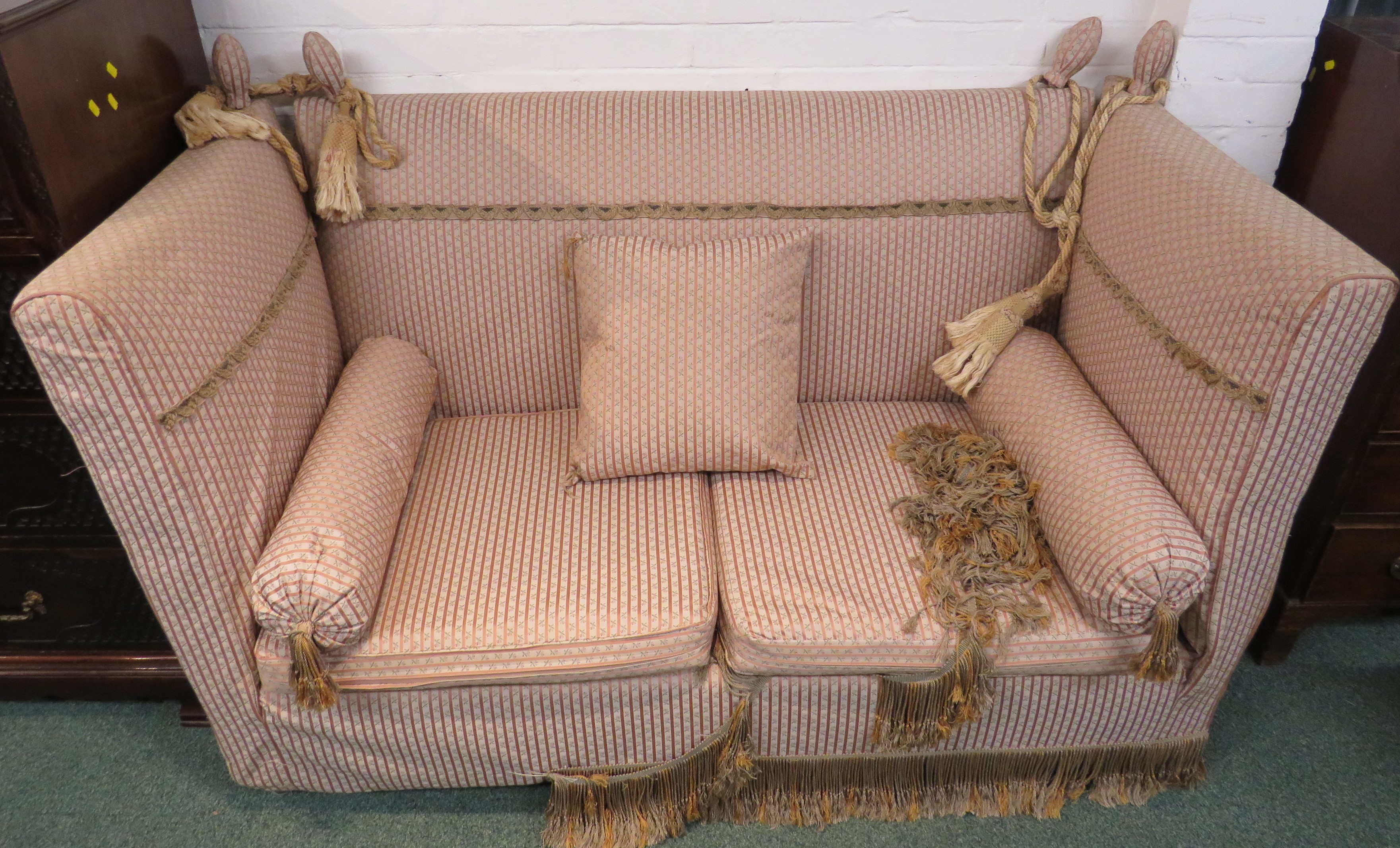 A drop-end Knoll sofa re-upholstered in pink and cream narrowly striped fabric with florets,