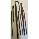 A hickory cane with London silver cap (length 92cm), and a small bundle of sticks and whips (in