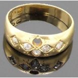 18 carat gold gypsy ring with a foliate setting for six small diamonds of which five remain, British