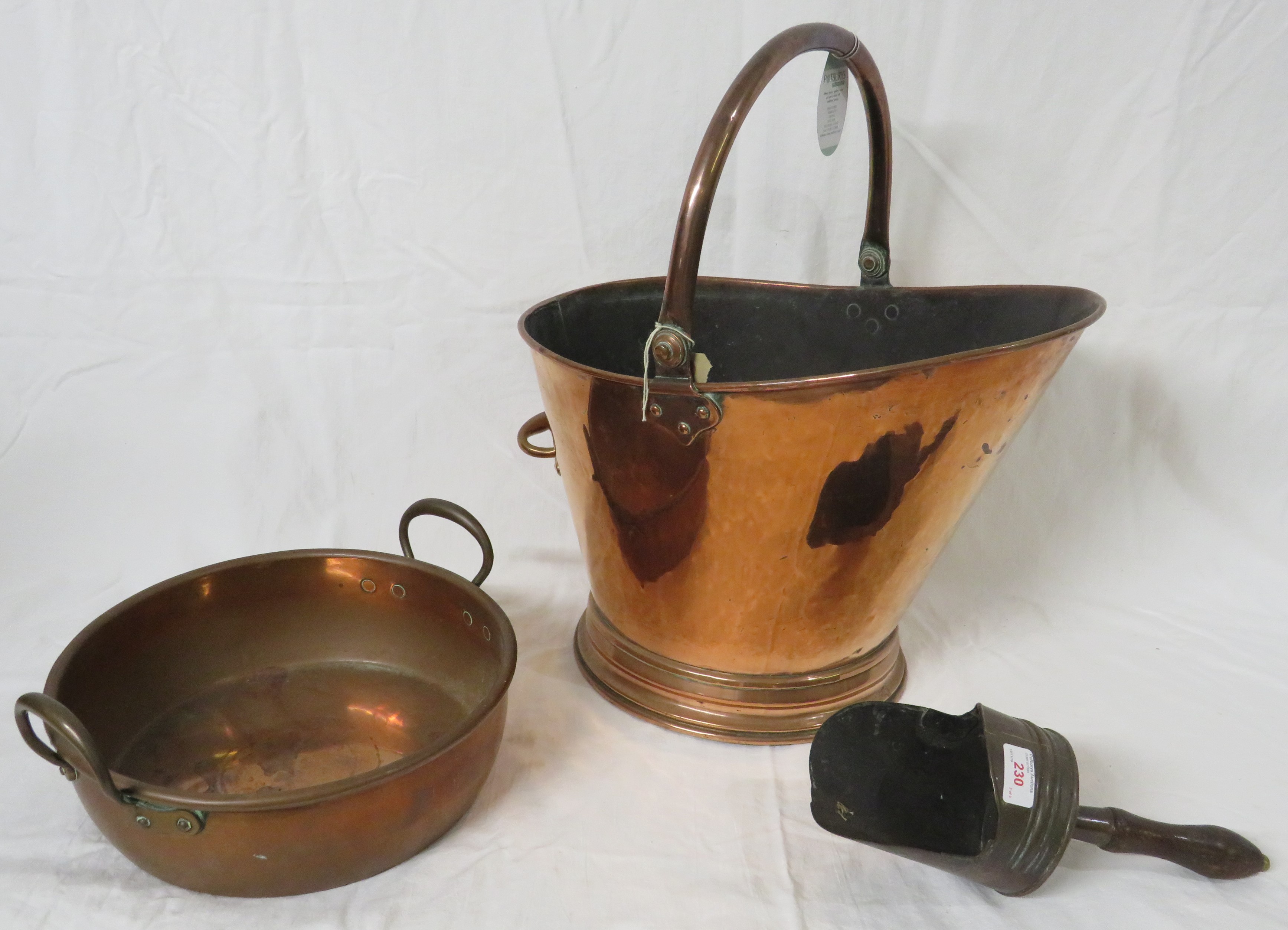 Large Victorian copper coal bucket on oval foot, with hinged handle and a handle to the back (height