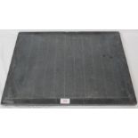 A slate shove halfpenny board, 55cm x 41cm, with five QEII pre-decimal half-pennies