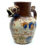 Baron Ware Barnstaple pottery motto jug with fish head spout and fish tail handle, "GOOD WISHES TO