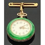 An early 20th century Swiss 935 silver lady's fob watch with green enamel and gilt case, attached