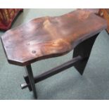 Rustic stained oak plank side table with dowel joins, the top of irregular oblong natural shape, two