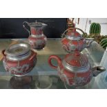 CHINESE POTTERY FOUR PART TEA SET WITH APPLIED PEWTER DECORATION OF DRAGONS