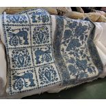 TWO WOVEN WOOLLEN FLOOR COVERINGS, CREAM GROUND WITH BLUE FLORAL DESIGN