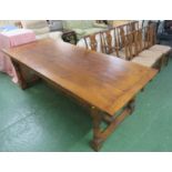 LARGE OAK DINING TABLE AND SEVEN CHAIRS INCLUDING ONE CARVER WITH UPHOLSTERED SEATS