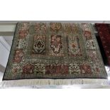 DEEP BLUE / BEIGE GROUND FINELY WOVEN RECTANGULAR FLOOR RUG WITH FLORAL MOTIFS AND TASSELLED ENDS