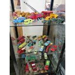 THREE SHELVES OF VINTAGE CORGI AND DINKY DIE-CAST VEHICLES OF VARIOUS SCALES INCLUDING CHIPPERFIELDS
