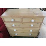 STRIPPED PINE CHEST OF TWO SHORT OVER THREE LONG DRAWERS WITH CHINA HANDLES