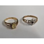 9-CARAT GOLD DRESS RING SET WITH SIX WHITE FAUX STONES AND ONE BLACK STONE IN FLORET SETTING (1.3G),