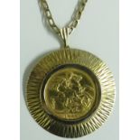 EDWARD VII 1909 GOLD SOVEREIGN MOUNTED IN 9-CARAT GOLD SURROUND, WITH 9-CARAT GOLD CHAIN WITH
