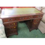 MAHOGANY VENEERED NINE DRAWER PEDESTAL DESK WITH GREEN LEATHER SCRIBER (FOUR KEYS IN OFFICE)