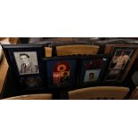 FOUR FRAMED AND GLAZED ITEMS OF ELVIS PRESLEY MEMORABILIA INCLUDING TICKET STUB, EP RECORDS AND