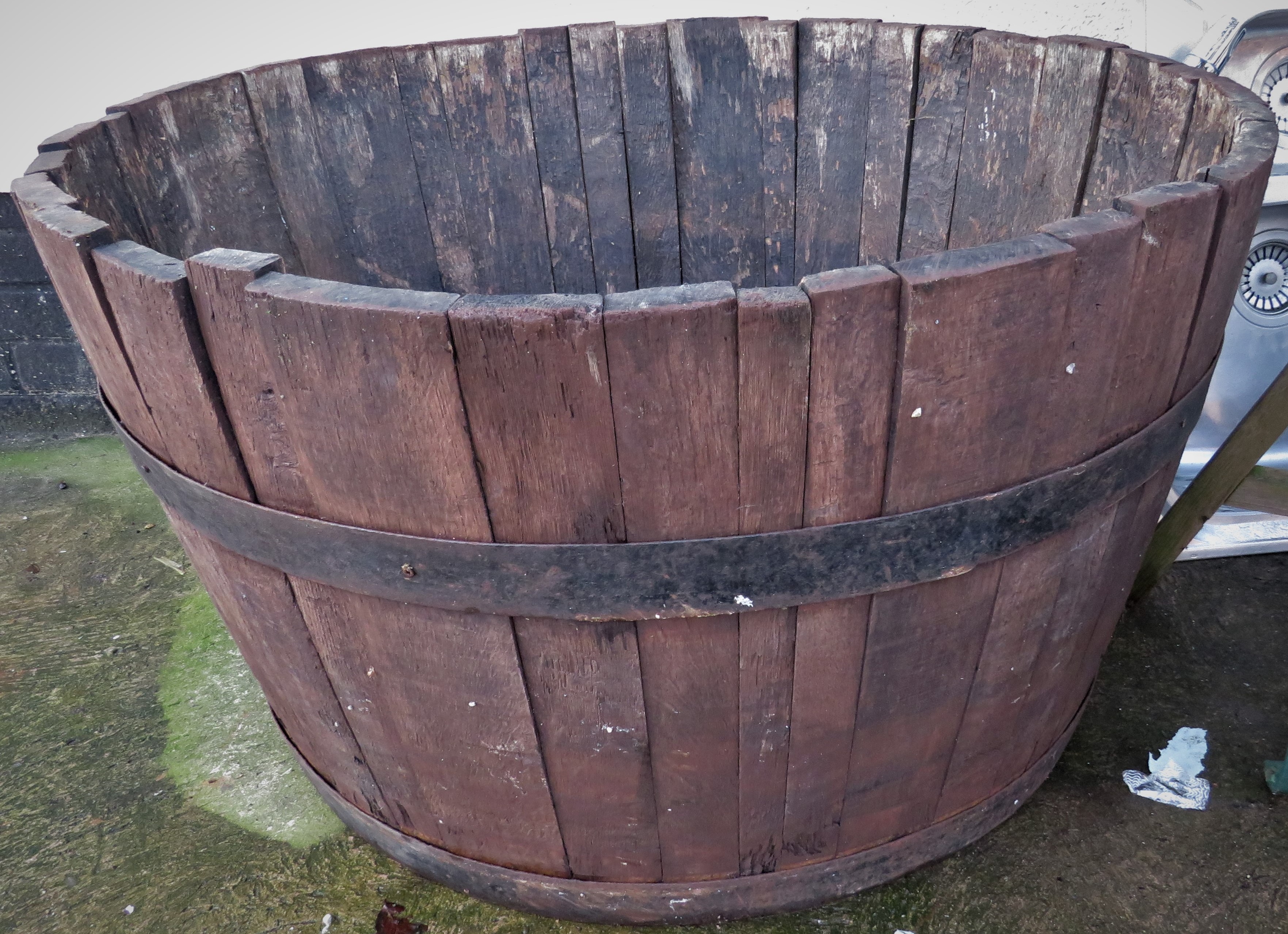 LARGE WOODEN AND METAL BANDED HALF BARREL PLANTER